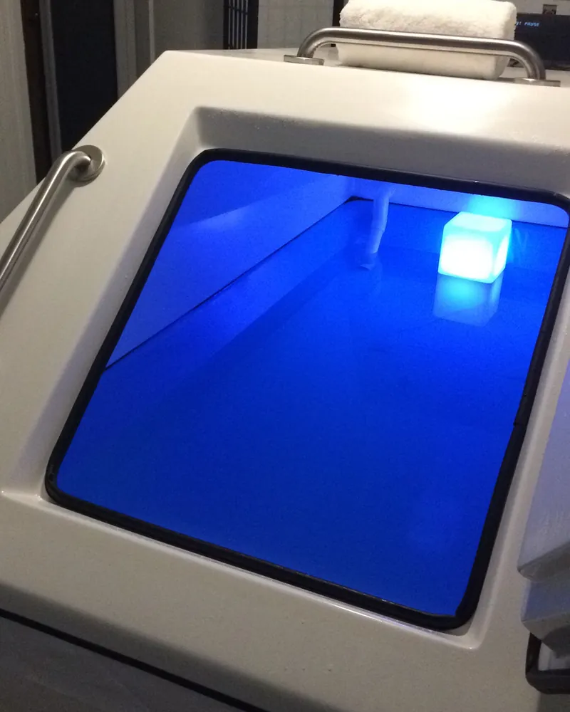 Private float room at JaxZen lit in soft blue