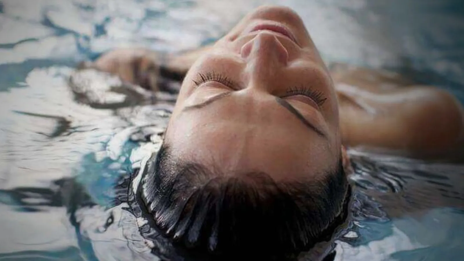 Guest floating weightlessly on the surface of warm salt water
