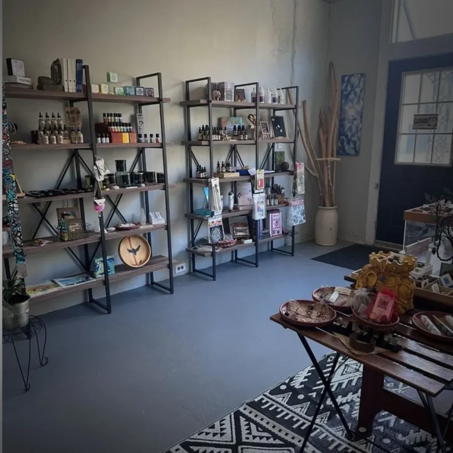 Boutique shelves of oils, candles, and gifts at JaxZen